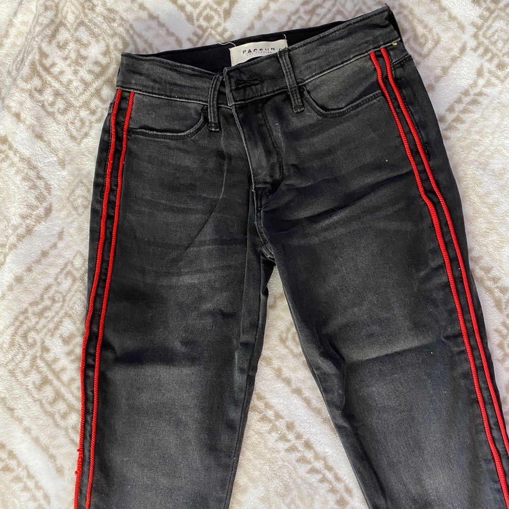 Pac sun black jeans with red stripe